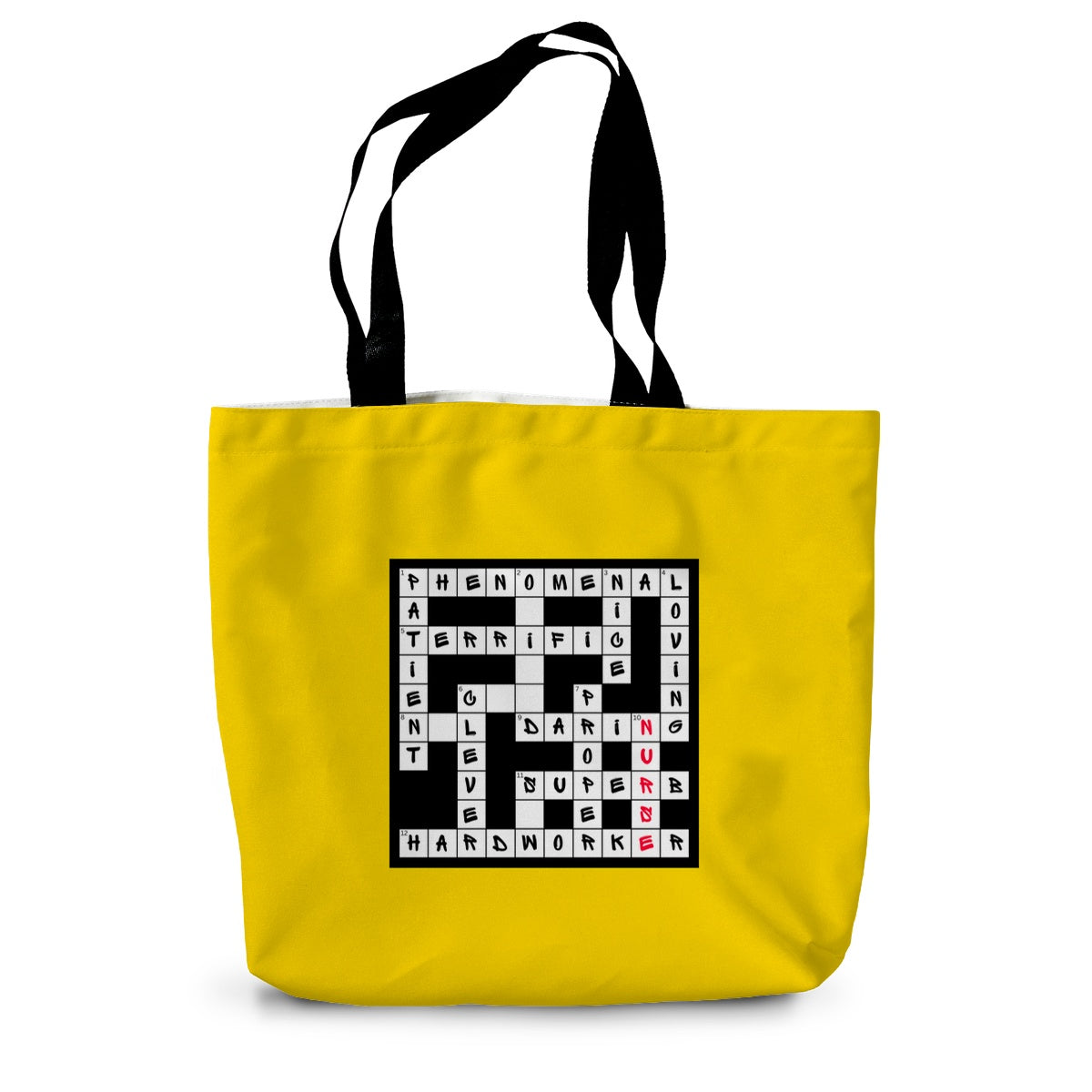 A bright yellow canvas tote bag with long black handles and a crossword design on the side filled with positive words in black and the word nurse in red.