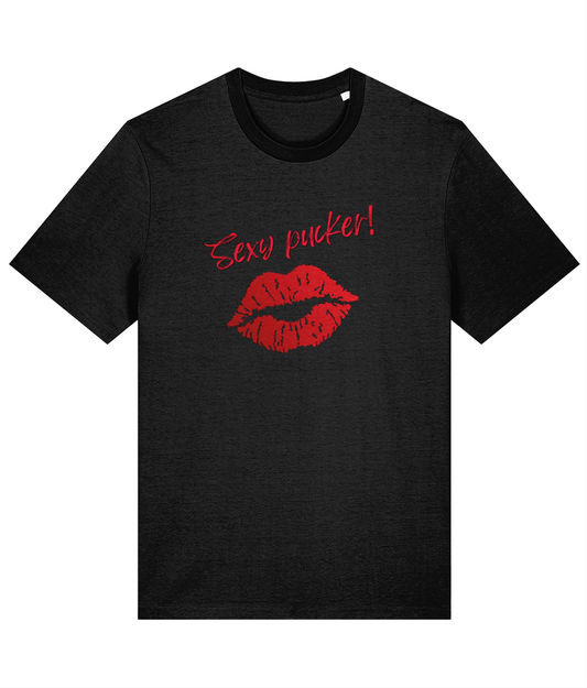 A black organic cotton unisex t-shirt with bright red lips and the words 'Sexy pucker!' on the chest.