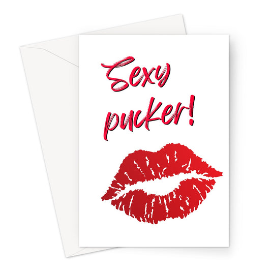 Blank greeting card with a white background. On the blank card is a pair of bright red cartoon lips and the words sexy pucker written above in red.
