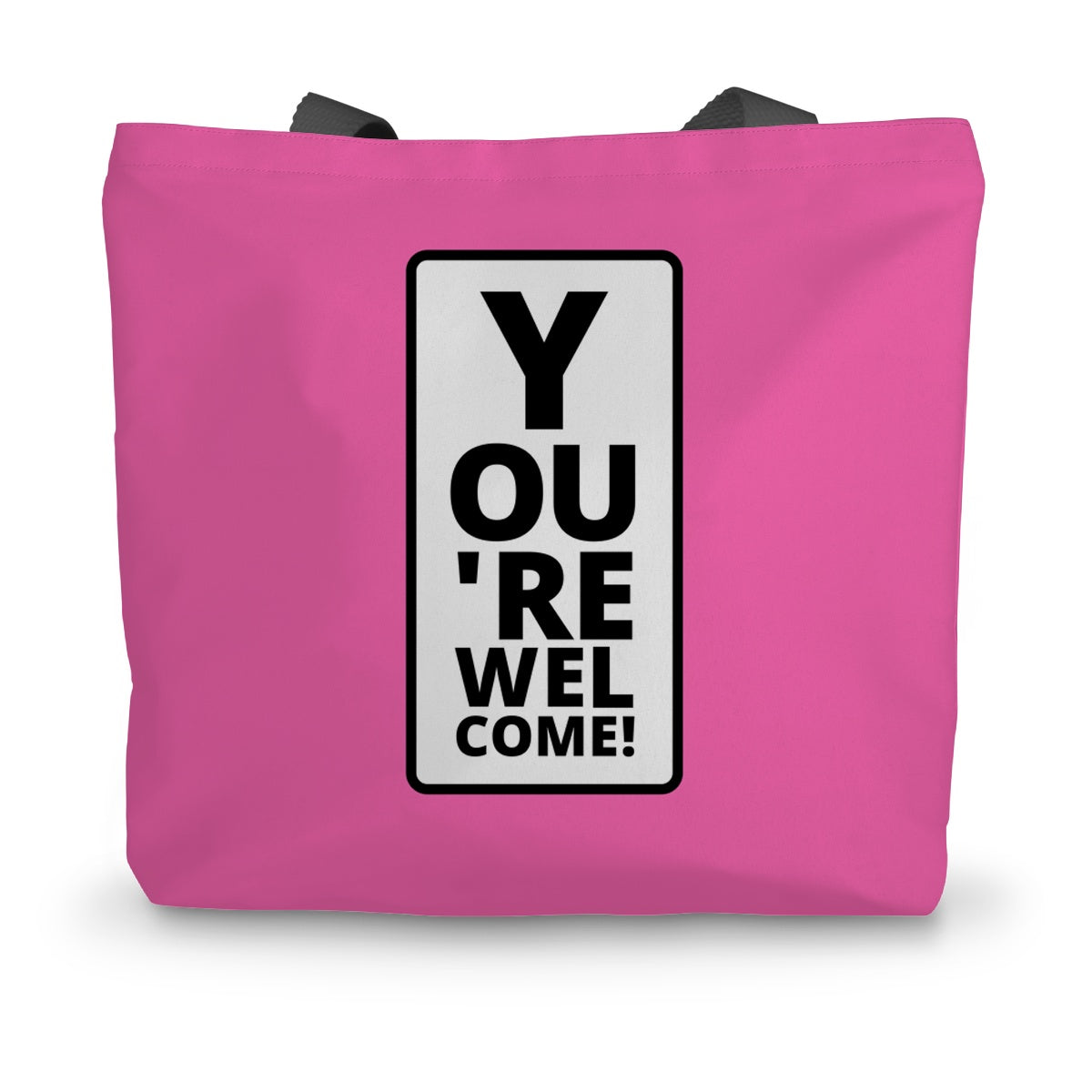 A hot pink canvas tote bag with black handles and an amusing eye test design on the side.