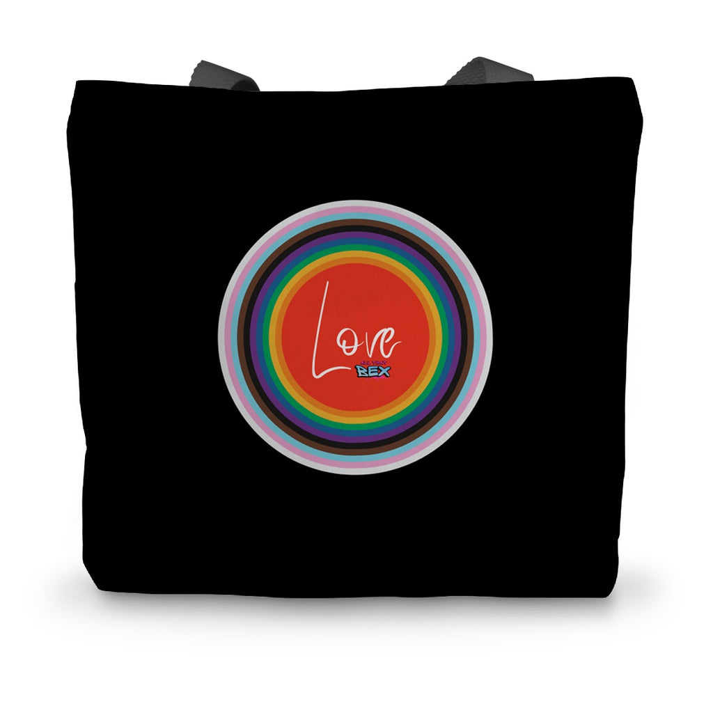 A black canvas tote bag with black handles and an LGBTQ+ design on the side.